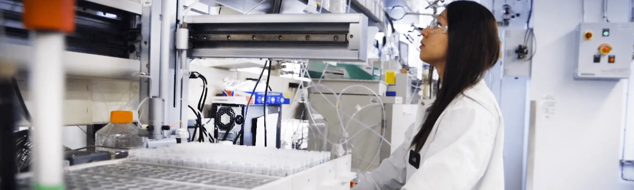 Scientist in laboratory working at a bench